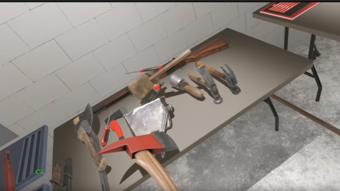 Screenshot of a table with a selection of hand tools - saws, hammers, and axes. The player holds a fireaxe in the foreground.